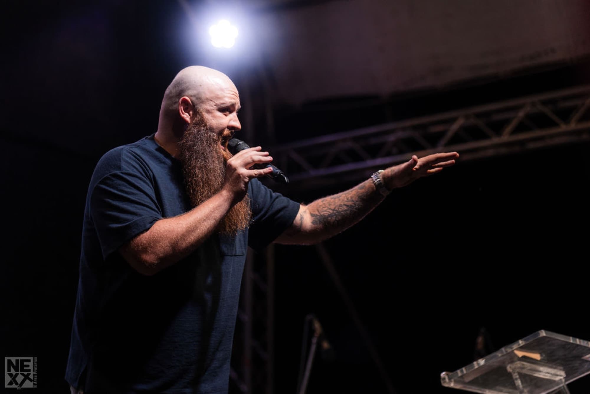 Preaching through haze under stage light